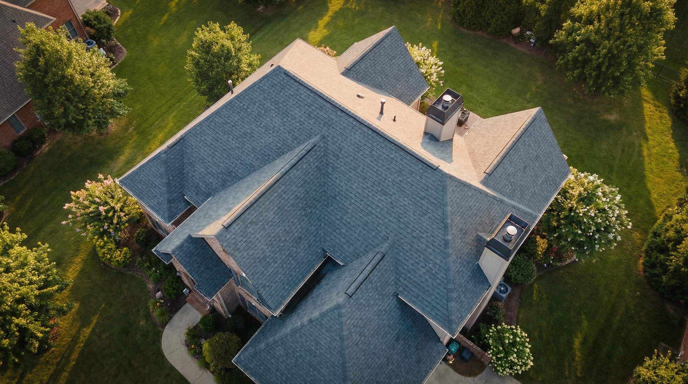 Professional roofer working at sunset